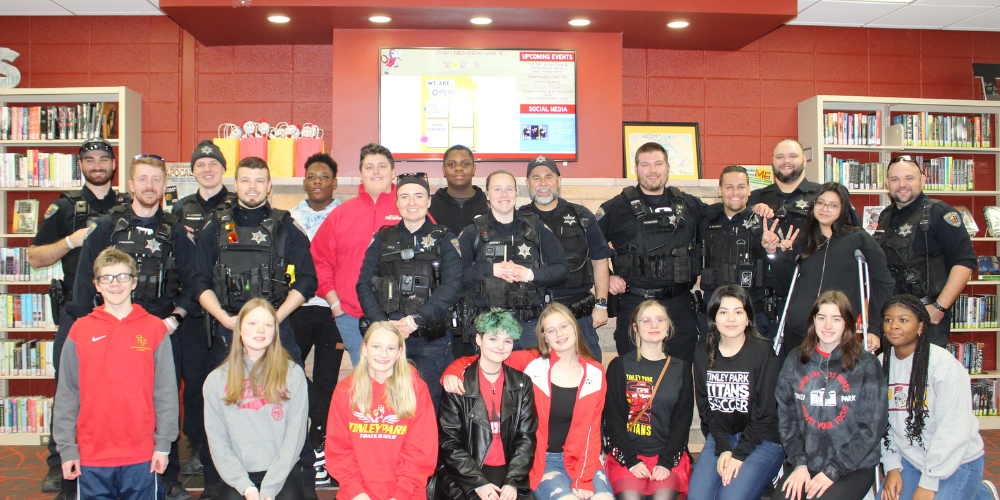 See Something, Say Something Club poses with Tinley Park Police Officers
